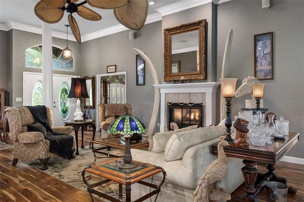 Living Room looking towards entrance and den. Fan blades are real palm fronds