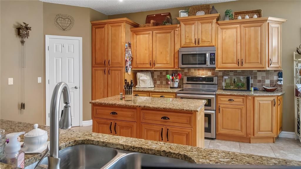 Kitchen with granite counters and wood cabinets