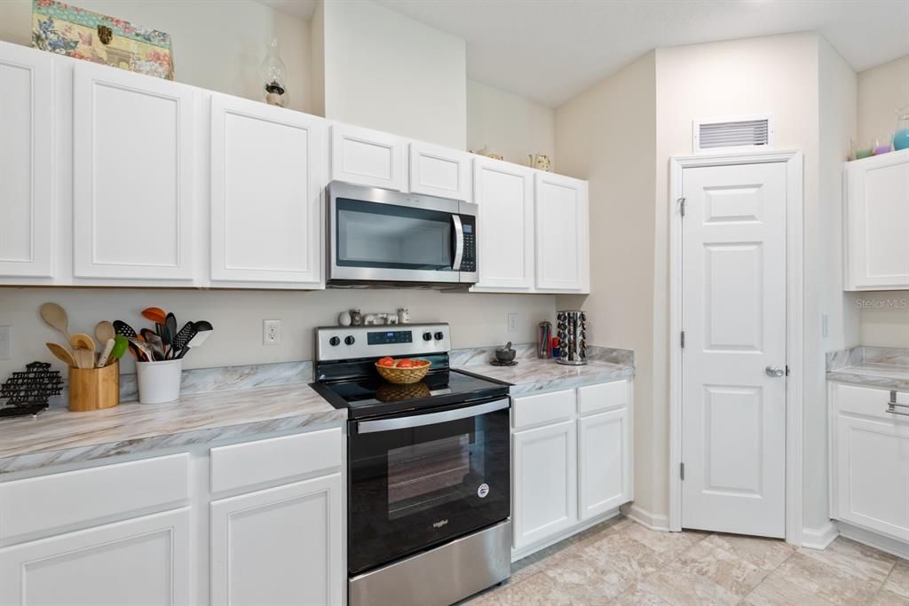 Kitchen featuring corner walk-in pantry.