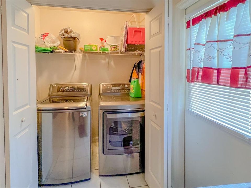 Kitchen with lots of window light and laundry closet