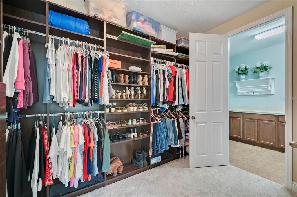 ONE OF TWO WALK-IN CLOSETS complete with CUSTOM SHELVING!