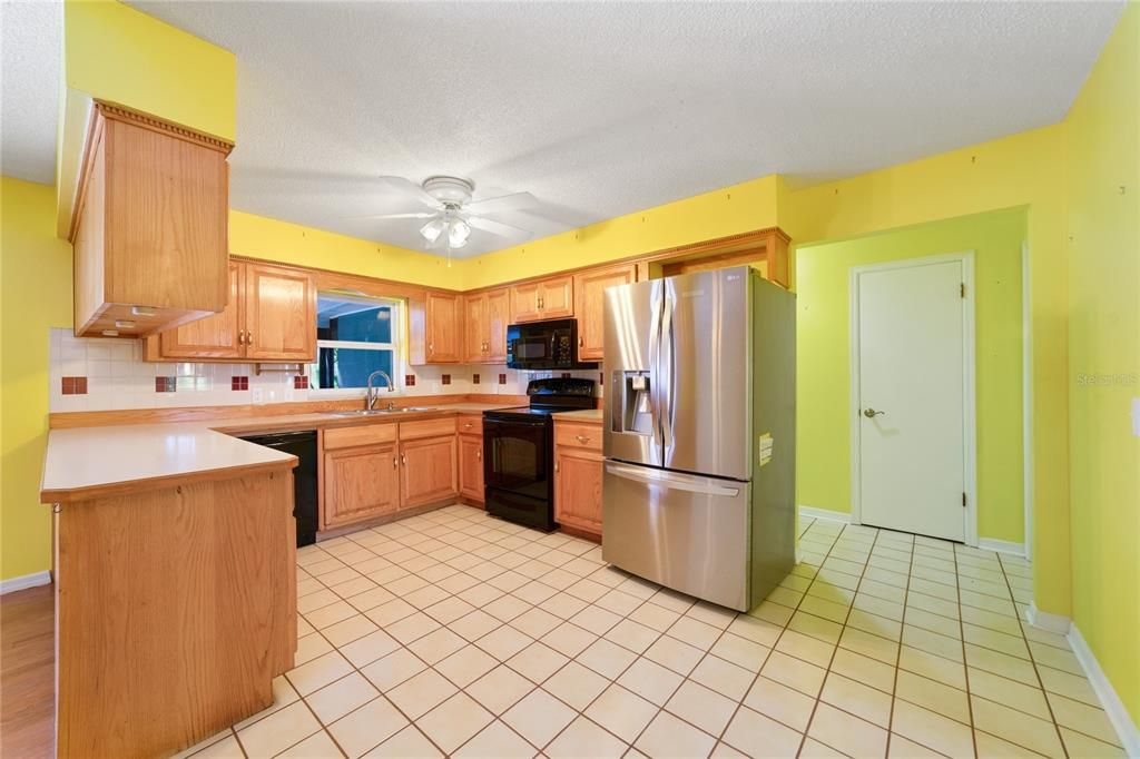 The KITCHEN offers quality appliances, plenty of cabinet and counter space, a TILED BACKSPLASH and BREAKFAST BAR seating for casual dining also perfect for entertaining!