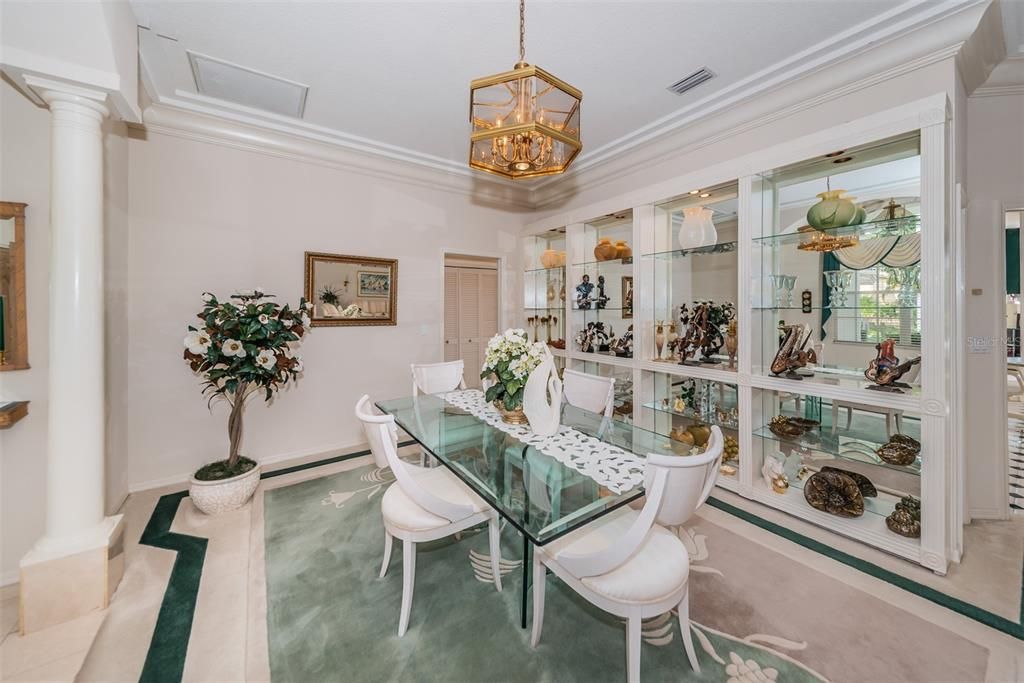 Formal Dining with built in shelving and access to kitchen