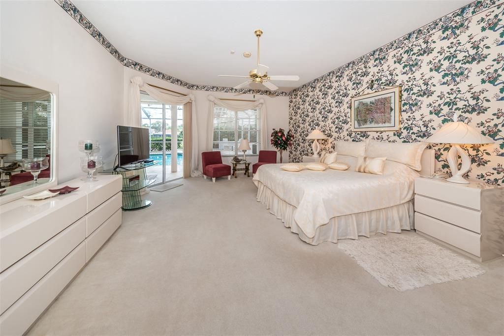 Master Bedroom with sitting area and sliders to the patio