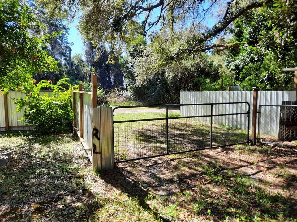 Completely Fenced Property.  Large Gate and Small Walk-Thru Gate.