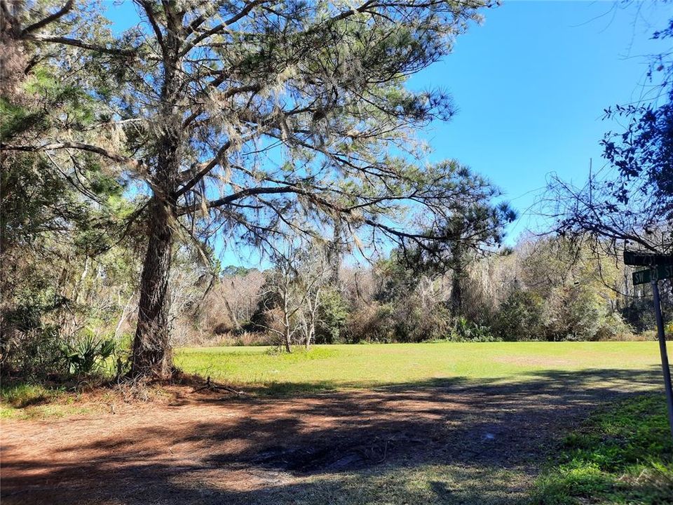 Directly across street; park like setting; community boat ramp