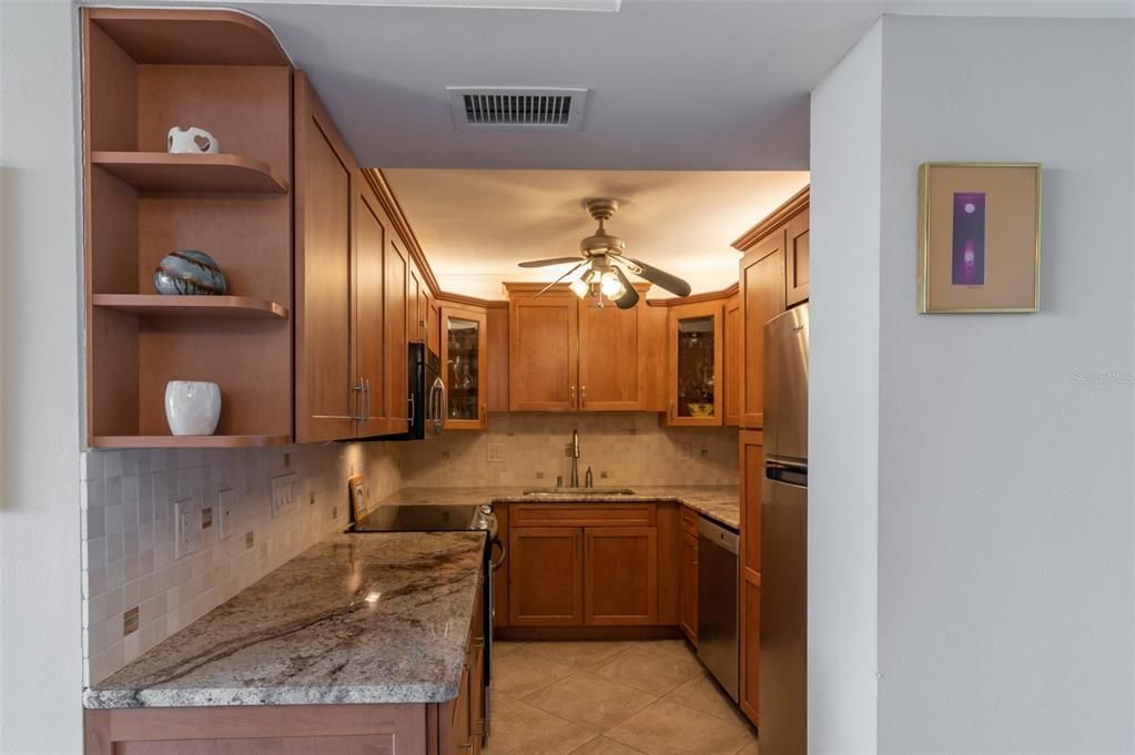 Galley kitchen with stainless steel appliances