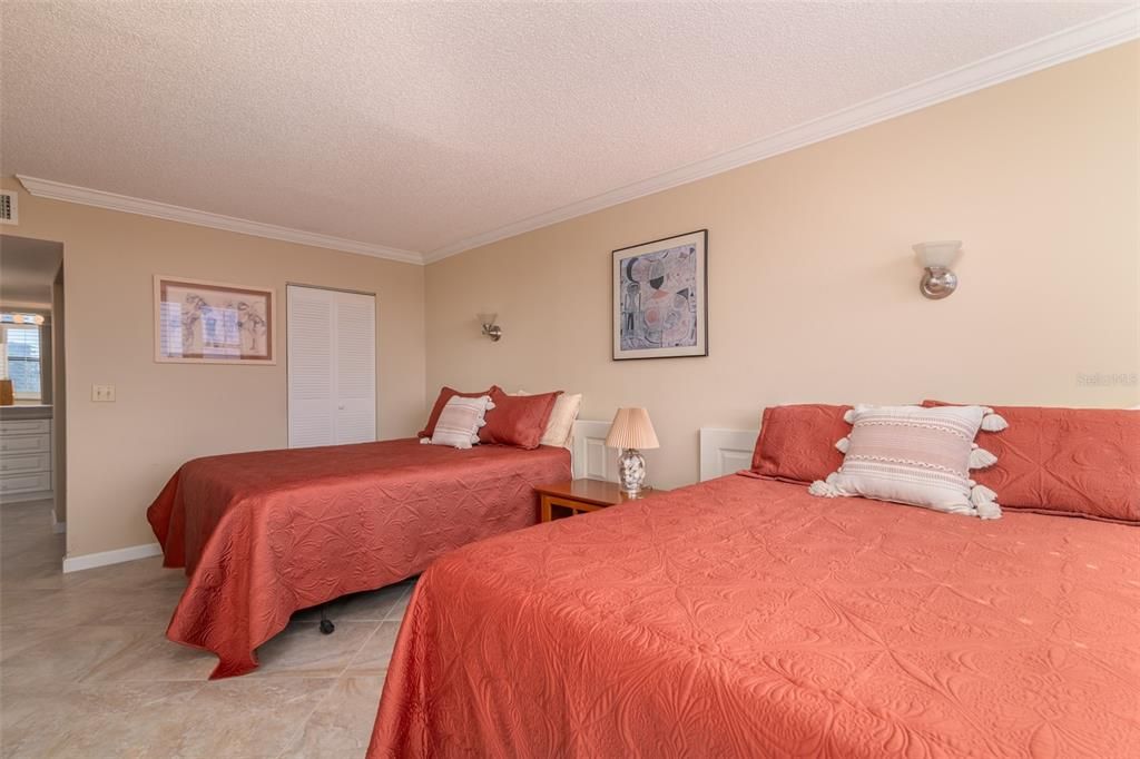 Two queen beds with walk-in closet.