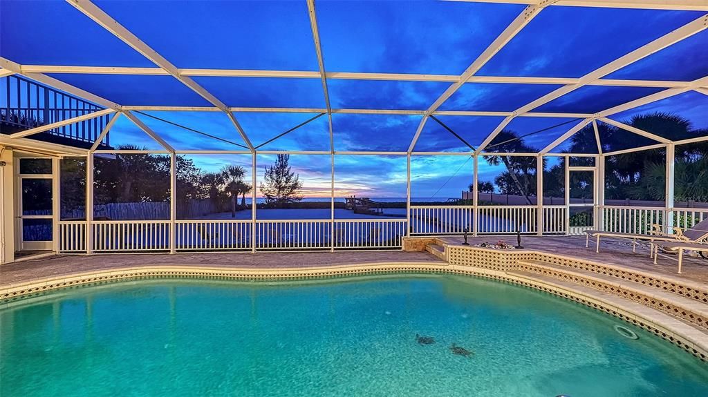 Swimming Pool with background view of the patio/Gulf water.