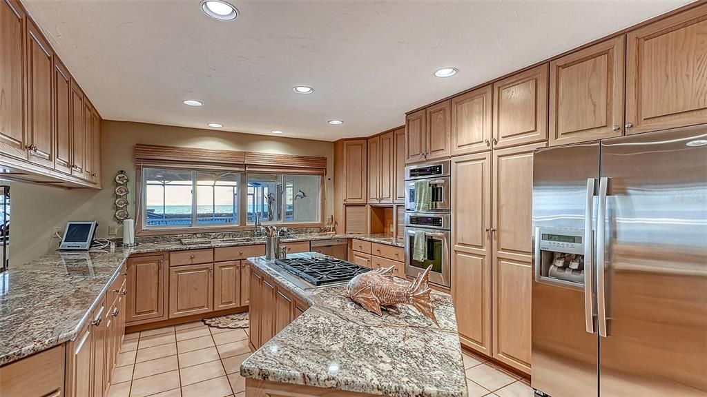 Kitchen Area / Granite Counters / Stainless Steel Appliances.