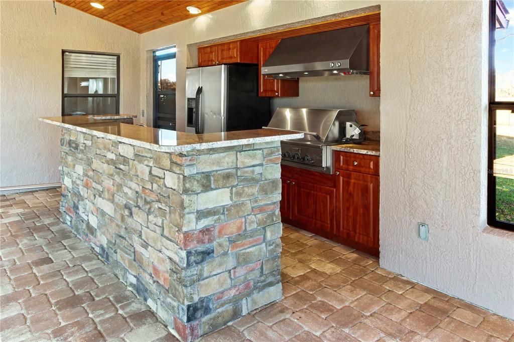 a summer kitchen with granite counter...