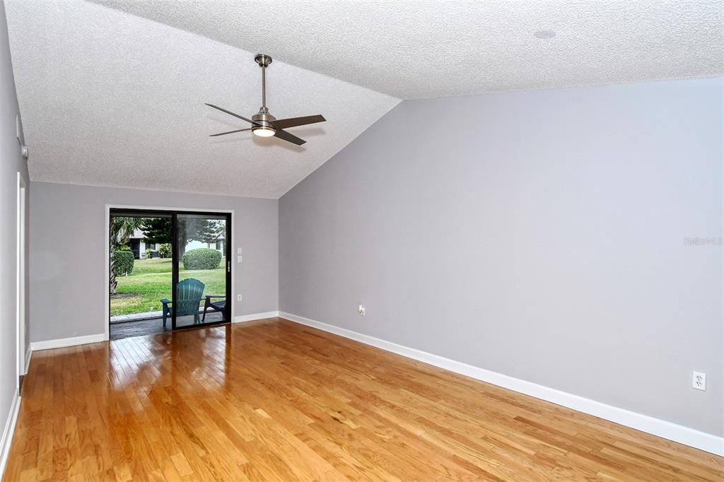 Gorgeous hardwood floors, cathedral ceiling and brand new ceiling fan!
