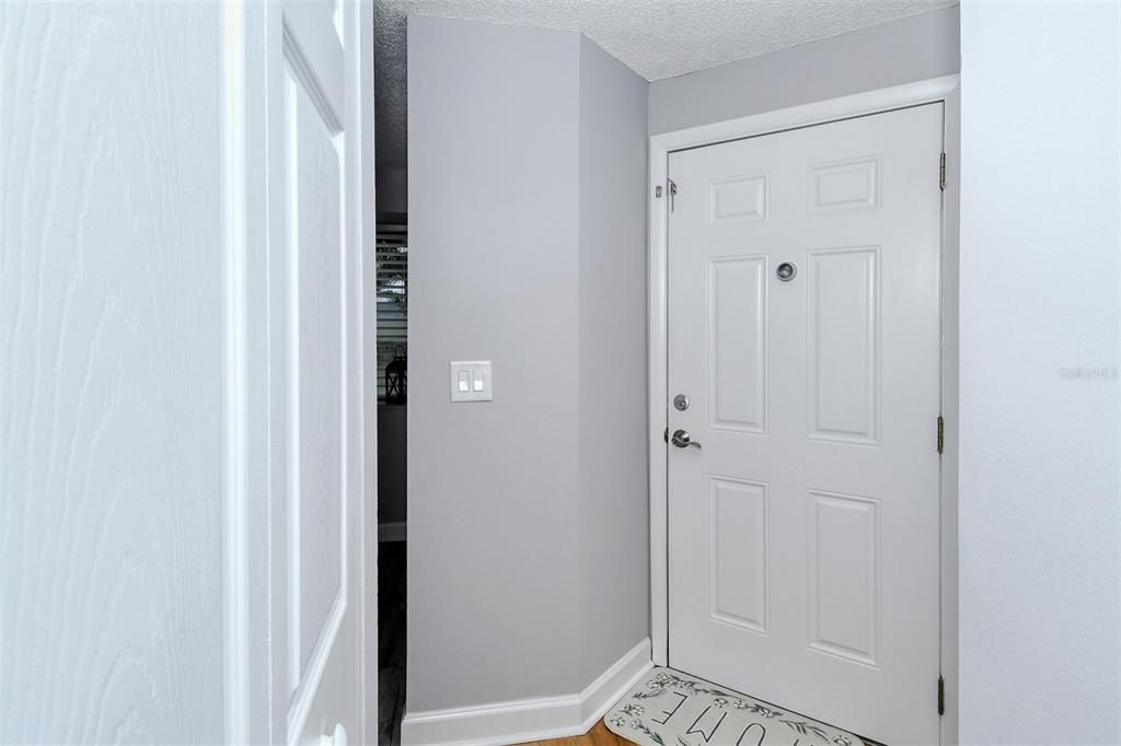 Entry door with hallway and closet.
