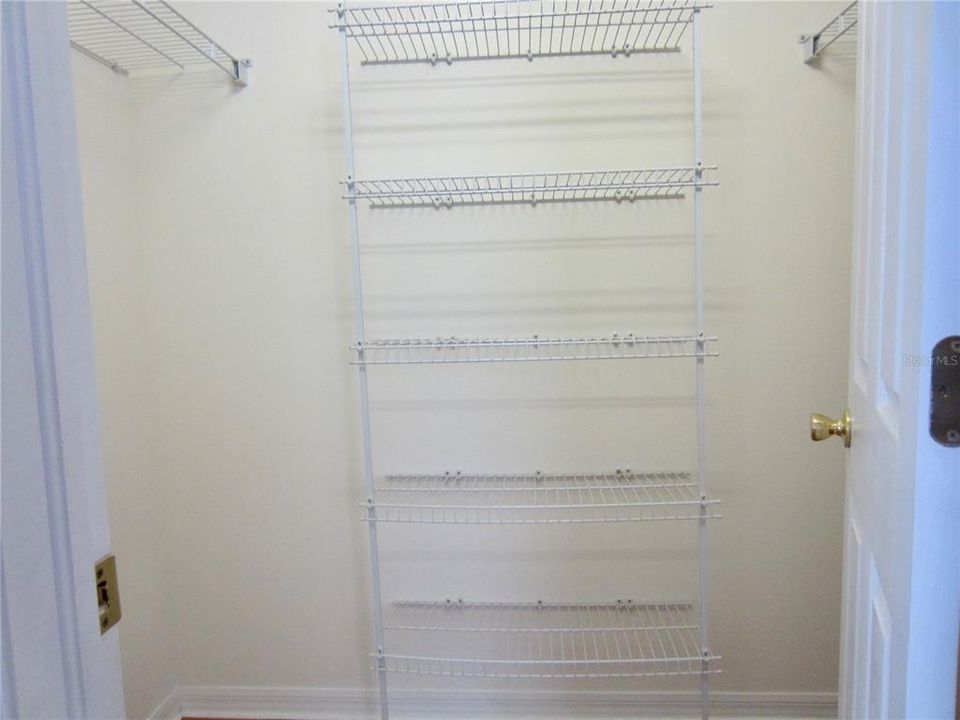 a Walkin closet for Guest bedroom #3 on the left side of upper floor