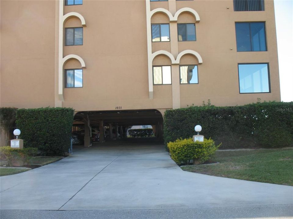 Side entrance to covered parking lot under building