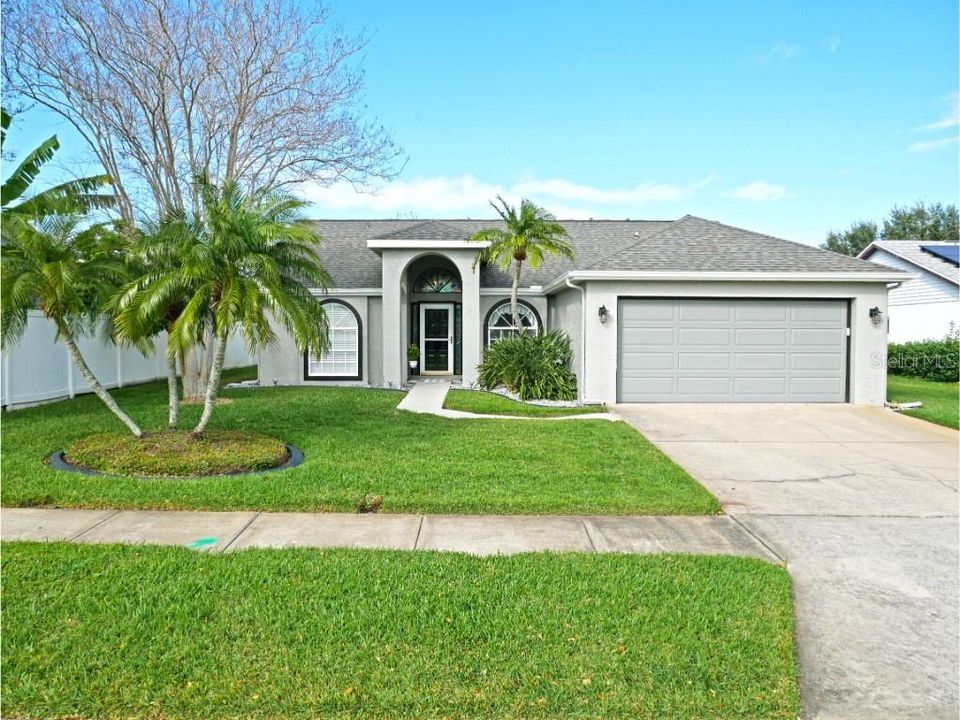 Front of home, nicely landscaped and fresh paint and roof!