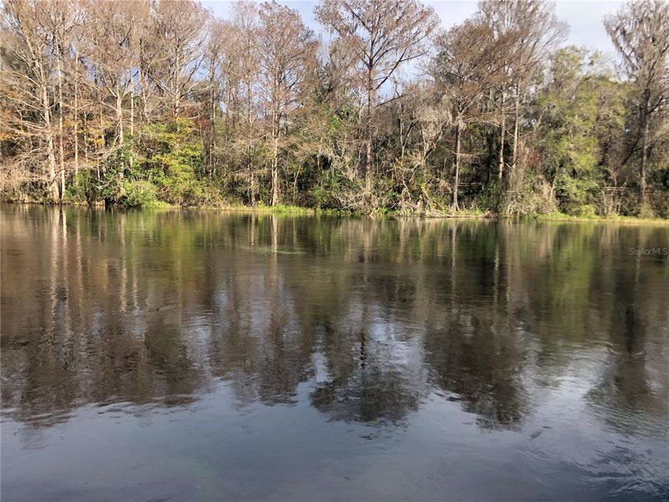 CRYSTAL CLEAR RAINBOW RIVER LOOKING FROM DOCK TO EAST SHORE