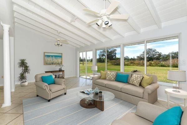 Staged Florida Room with Vaulted Ceiling