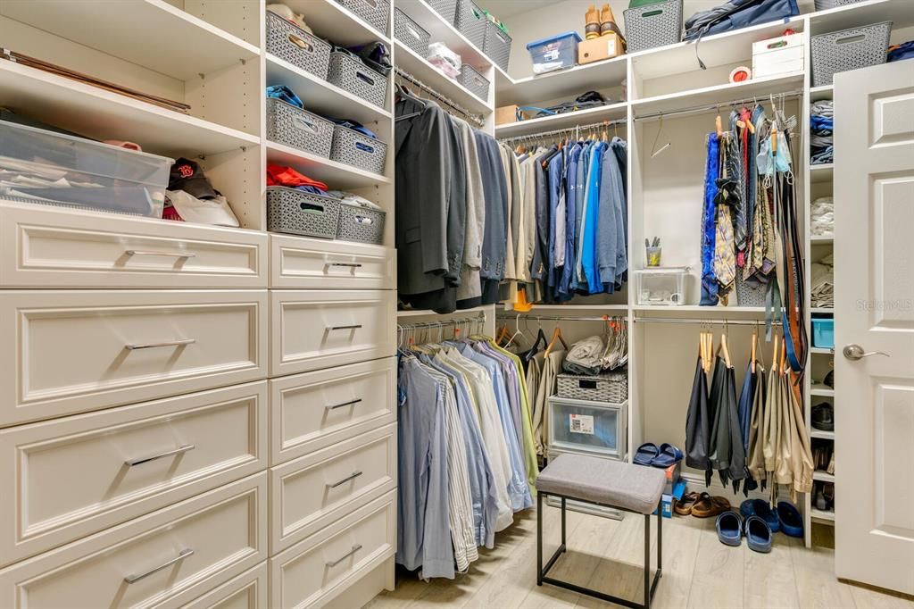 EXTRAORDINARY MASTER CLOSET WITH ELABORATE BUILT-INS