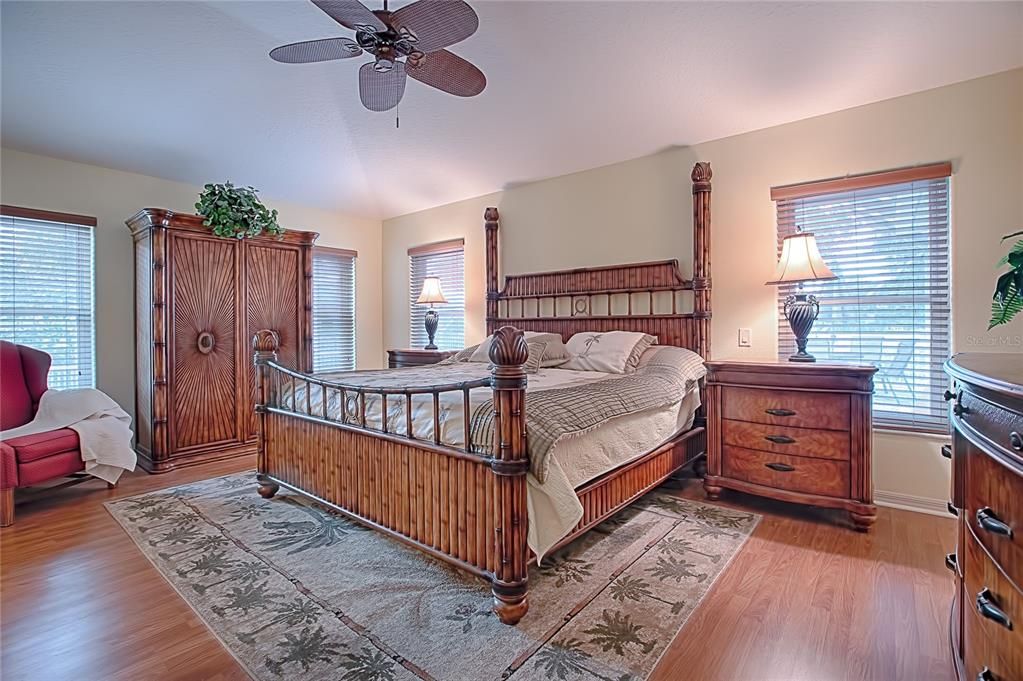Spacious master bedroom with laminate flooring