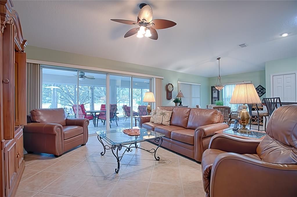 large living room with a view of the golf course