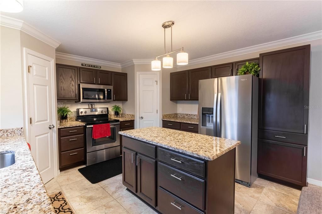 VIEW OF KITCHEN FROM DINING ROOM