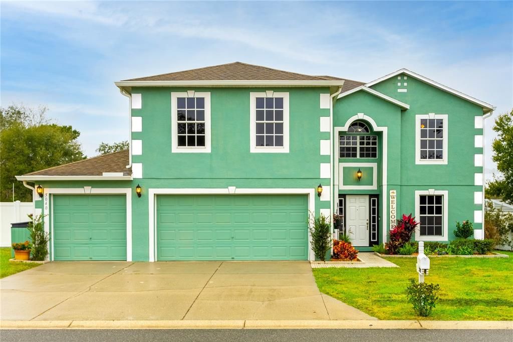 FRONT OF HOME AND 3 CAR GARAGE