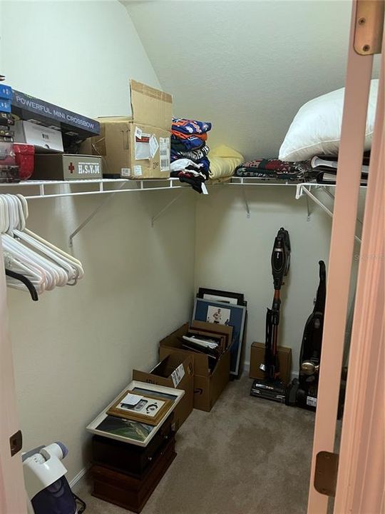 WALKIN CLOSET WITH LOTS OF SPACE.