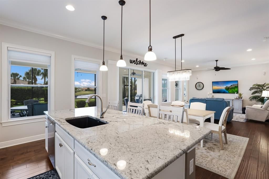 KITCHEN ISLAND WITH NEWLY UPDATED PENDANT LIGHTS