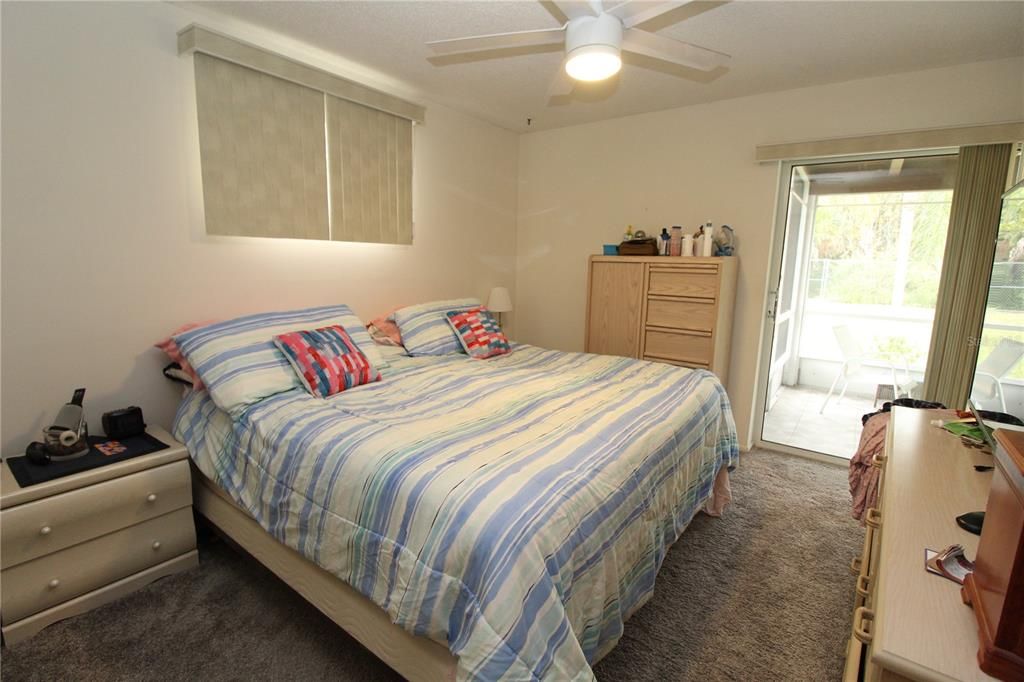 Master Bedroom is spacious with mini sliding glass door out into the screened covered lanai.