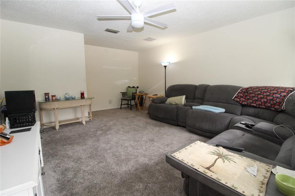 As you walk in the front door you enter the spacious living room with newer carpet.