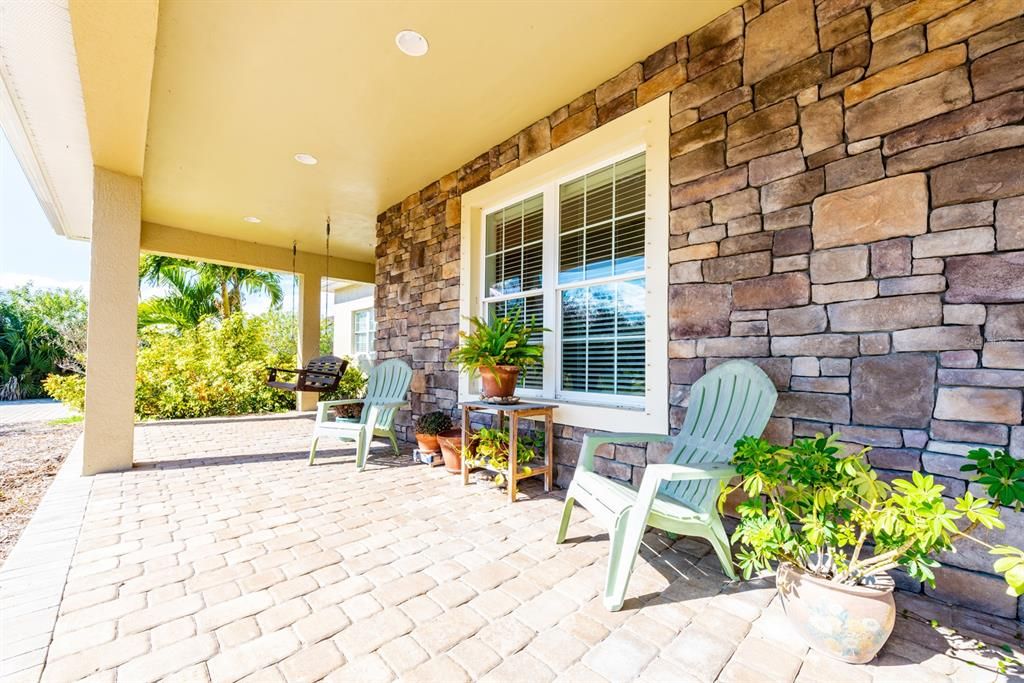 The long COVERED front porch is a perfect place to enjoy a cup of coffee in the morning!