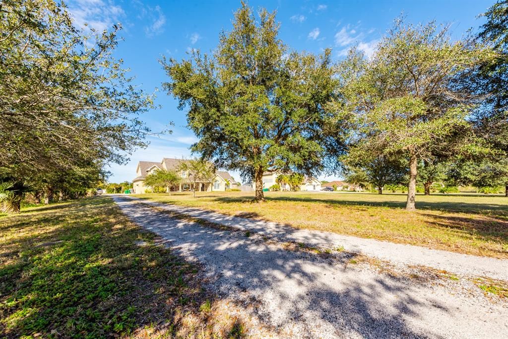 As you make your way up the long driveway take notice of the curb appeal starting with the STONE ACCENTS, and the extended COVERED front porch!