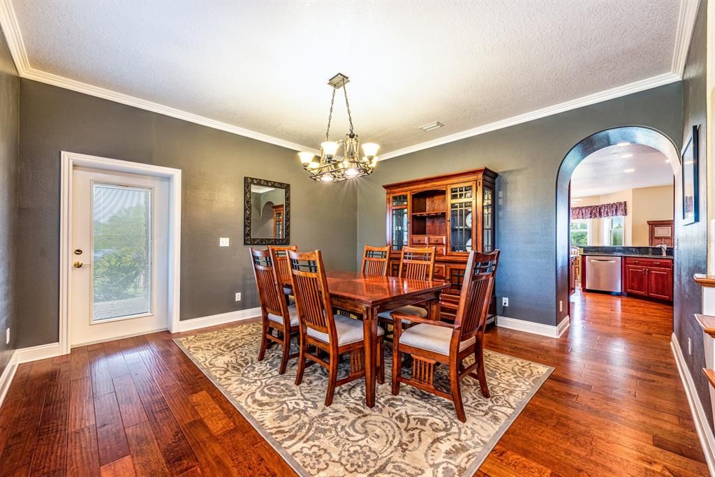 Start your tour in the FORMAL DINING AREA to the left offering both access to the kitchen and front porch!