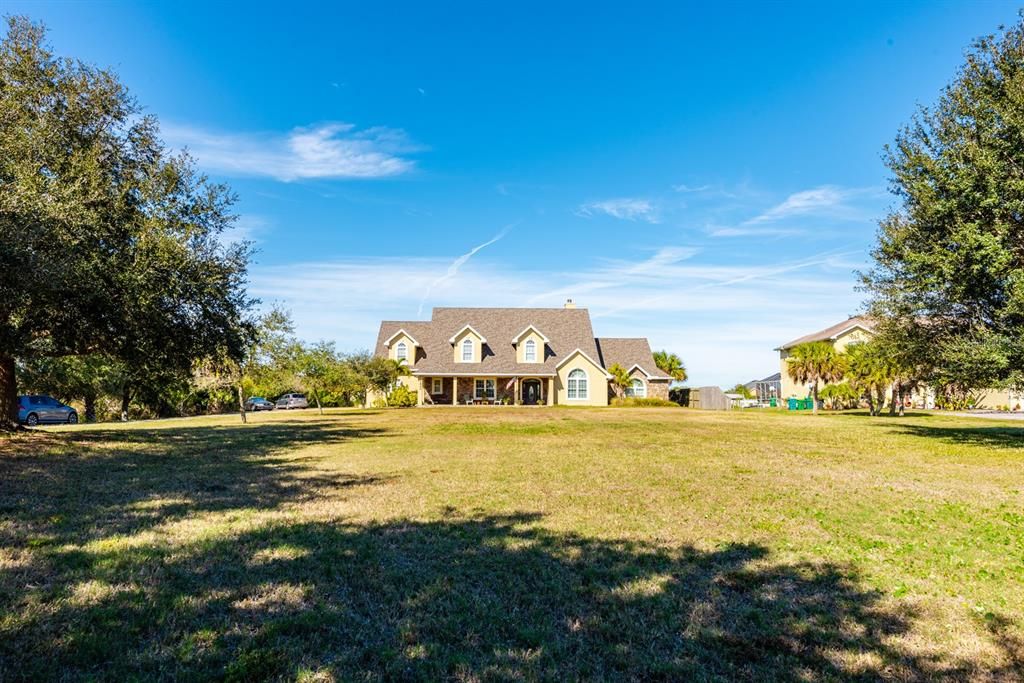 Homes like this don’t come around that often!! 2 ½ blissful ACRES in a great community and a gorgeous 5BD/4.5BA HOME with a ton of UPGRADES (including a NEWER ROOF) a WATER VIEW and so much CHARM!