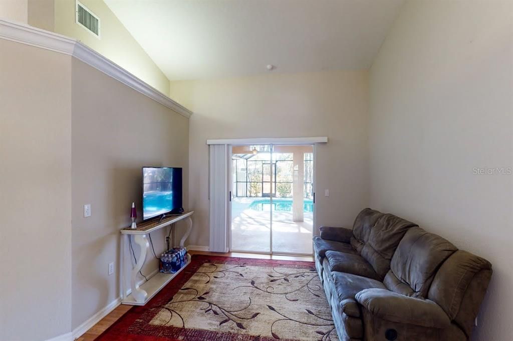 Bonus Room off Foyer with Sliding Glass Doors to Pool Area