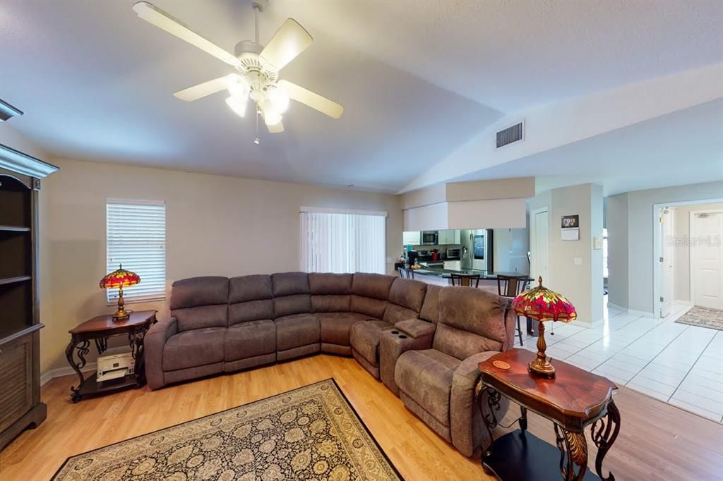 Family Room and Kitchen with Sliding Glass Doors to Pool Area