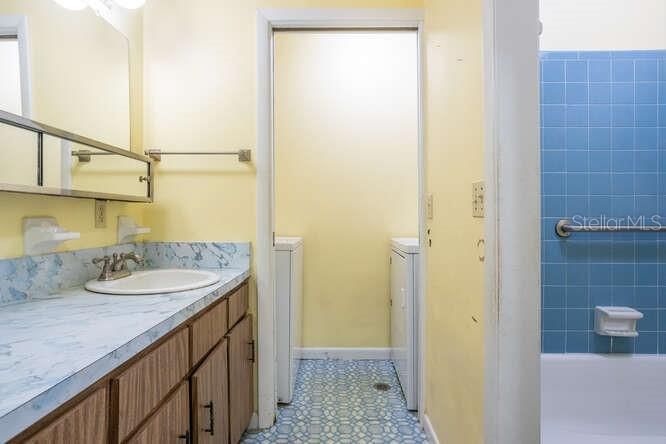 hall bath with view of laundry area