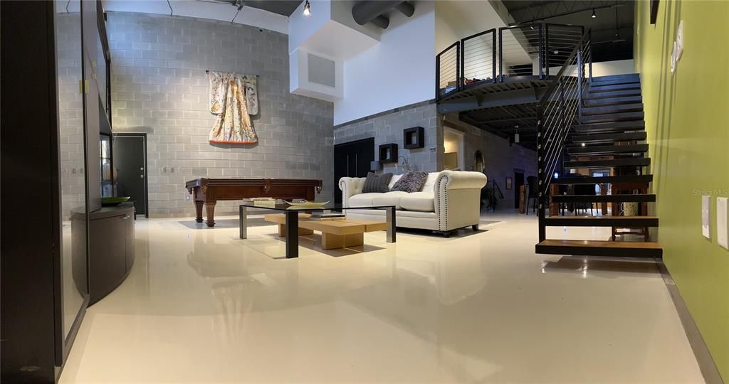 Living area with painted concrete floors in Living/Dining area