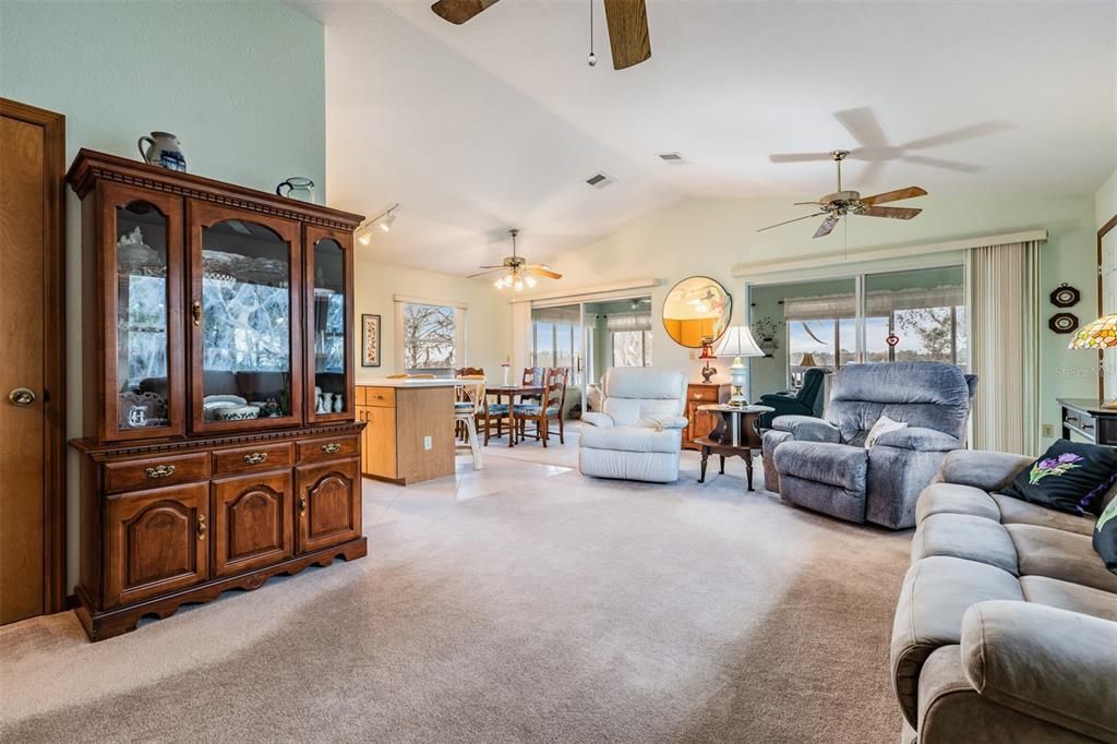 Large family room with view of the Lake, ceiling fans.