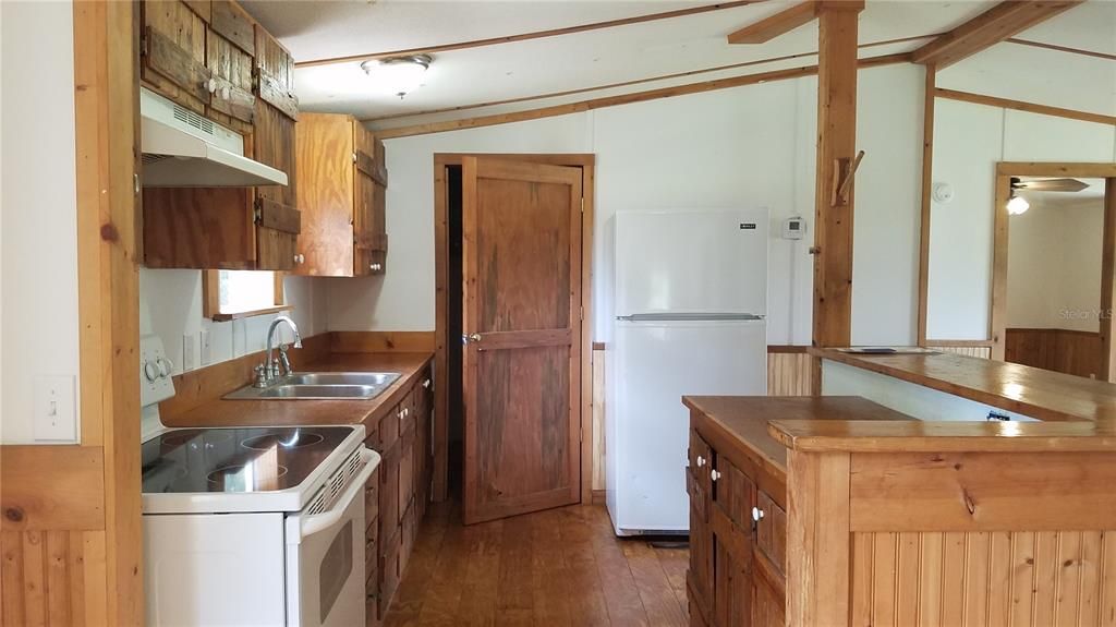 Kitchen, wood cabinets and utility room
