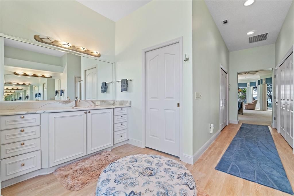 Right hand master vanity so there is no sharing in this his & her Quartz vanities on a tile floor.