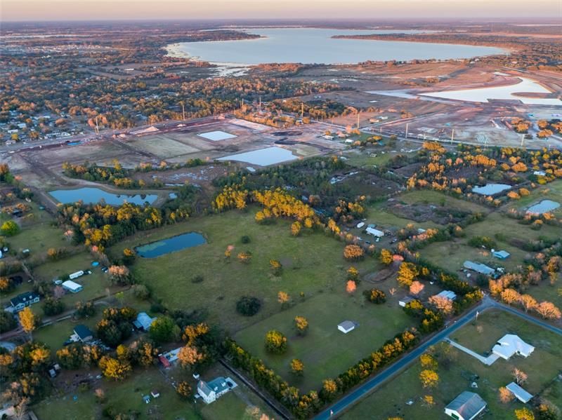 14.52 beautiful acres in the Manor, Alligator Lake in distance. National builders building to the north and to the east