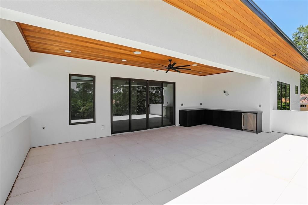 Off TV/lounge area kitchen and covered lanai