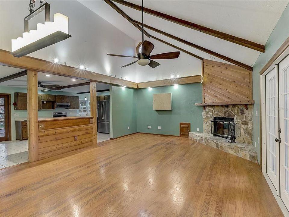 Open great room with vaulted ceilings and fireplace