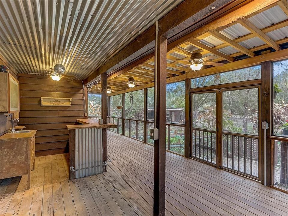 Screened porch with bar, sink and electricity