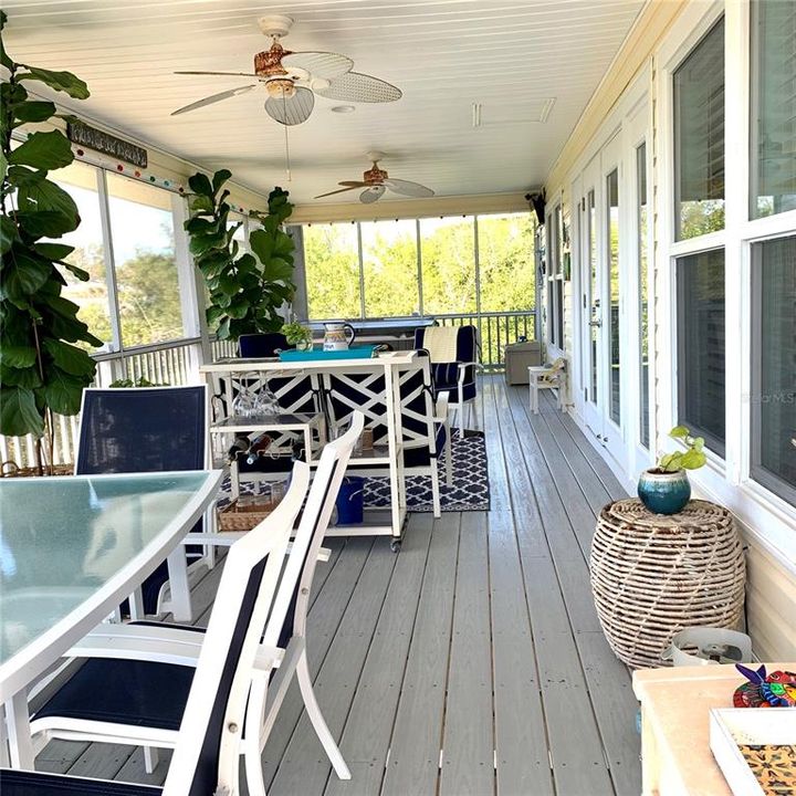 Large porch with jacuzzi tub and sitting & eating area. Great for reading, relaxing, or entertaining.
