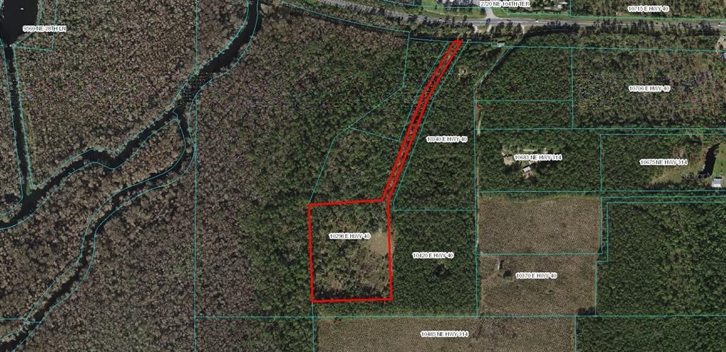 Aerial View with approximate property boundaries. Hwy 40 is at the top of the photo (North of the property), the Ocklawaha River and the Florida Greenway is on the left hand side (West of the property).