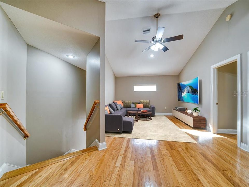 Virtually Staged Upstairs Loft with Beautiful Wood Floors & Natural Light