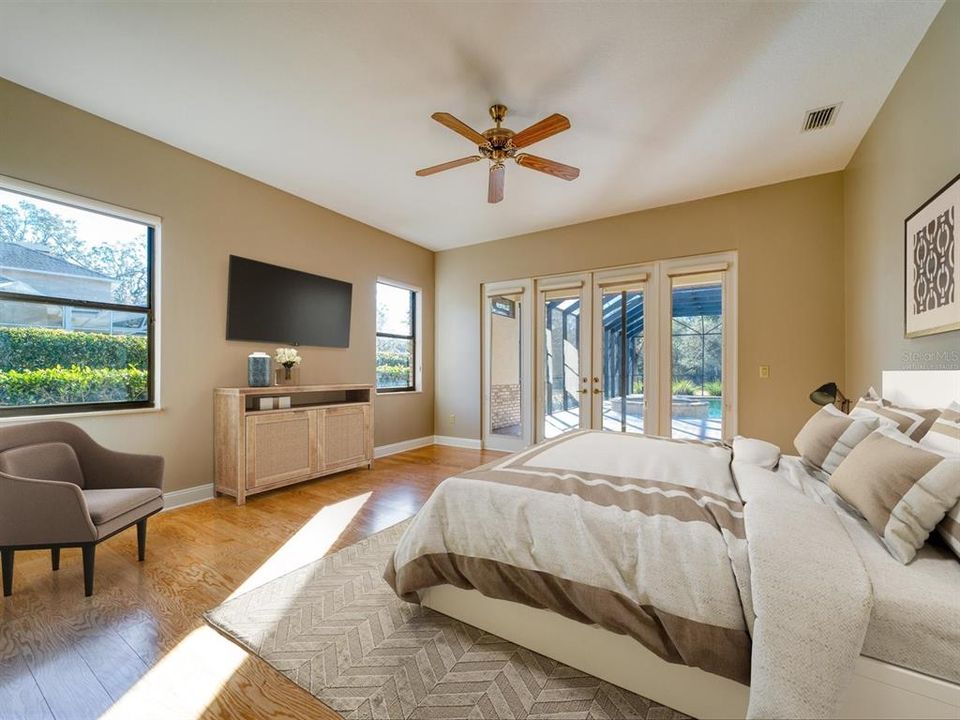 Virtually Staged. Master Suite is downstairs and overlooks the beautiful Lanai and Pool